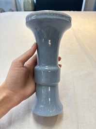 Three Chinese claire-de-lune vases, one with a wooden stand, Yongzheng mark, 19/20th C.
