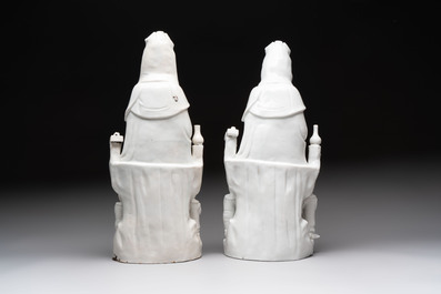 A pair of Chinese Dehua blanc de Chine groups of Guanyin with a child and servants, 18th C.