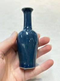 Three Chinese blue-glazed miniature vases on wooden stands and a claire-de-lune seal paste box and cover, 19th C.