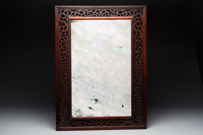 A Chinese lavender and green jadeite 'phoenix' plaque in a hongmu frame, early 20th C.