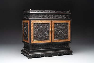A Chinese zitan cabinet of curiosities with five-clawed dragons, 19/20th C.