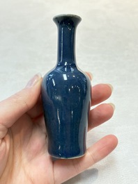 Three Chinese blue-glazed miniature vases on wooden stands and a claire-de-lune seal paste box and cover, 19th C.