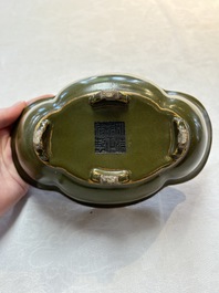 A fine Chinese teadust-glazed quadrifoil jardini&egrave;re with an openworked wooden stand, Yongzheng mark and of the period