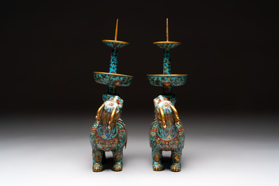 A pair of Chinese cloisonn&eacute; candlesticks and three vases, 19/20th C.