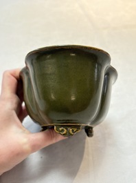 A fine Chinese teadust-glazed quadrifoil jardini&egrave;re with an openworked wooden stand, Yongzheng mark and of the period