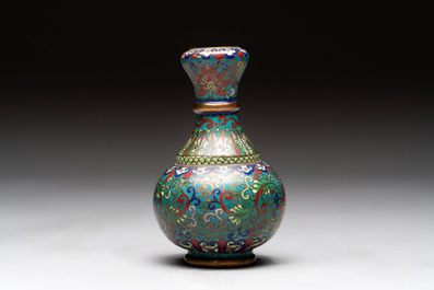A pair of Chinese cloisonn&eacute; candlesticks and three vases, 19/20th C.