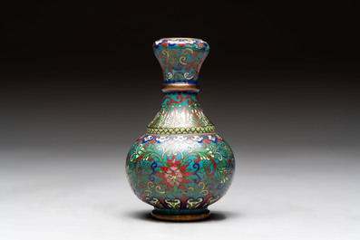 A pair of Chinese cloisonn&eacute; candlesticks and three vases, 19/20th C.