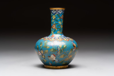 A pair of Chinese cloisonn&eacute; candlesticks and three vases, 19/20th C.