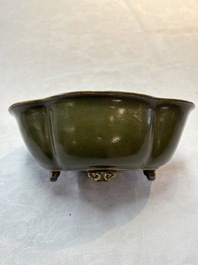 A fine Chinese teadust-glazed quadrifoil jardini&egrave;re with an openworked wooden stand, Yongzheng mark and of the period
