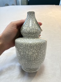 Two Chinese ge-type double-gourd vases, one with a wooden stand, 19th C.