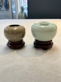A Chinese celadon-glazed water pot and a ge-type water pot on wooden stands, Qianlong mark, 19th C.