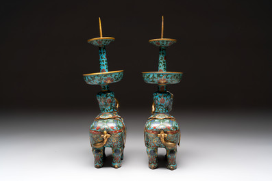 A pair of Chinese cloisonn&eacute; candlesticks and three vases, 19/20th C.
