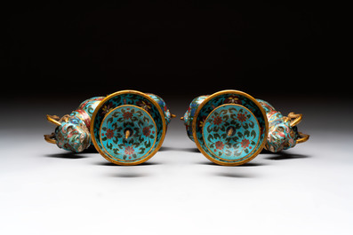 A pair of Chinese cloisonn&eacute; candlesticks and three vases, 19/20th C.