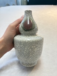 Two Chinese ge-type double-gourd vases, one with a wooden stand, 19th C.