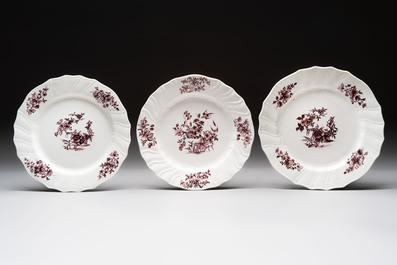 Seven manganese Tournai porcelain plates with floral design, 18th C.