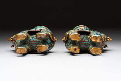 A pair of Chinese cloisonn&eacute; candlesticks and three vases, 19/20th C.