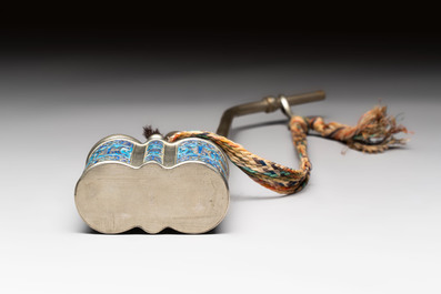 Two Chinese enamelled paktong opium pipes, an opium lamp and a cloisonn&eacute; opium lamp, 19/20th C.