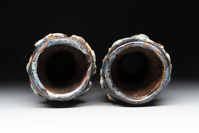 A pair of Chinese Shiwan polychrome hat stands with haut-relief figural design, 19/20th C.