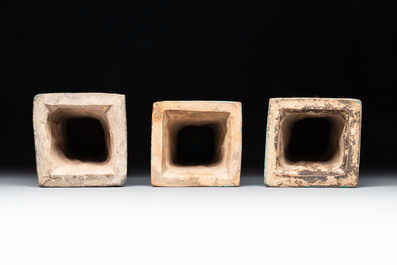 Three Chinese turquoise-glazed 'gu' vases with floral design, two with wooden stands, Ming