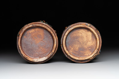 A pair of Chinese Shiwan polychrome hat stands with haut-relief figural design, 19/20th C.
