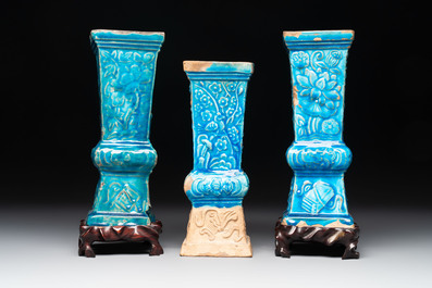 Three Chinese turquoise-glazed 'gu' vases with floral design, two with wooden stands, Ming