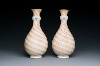 A rare pair of Chinese pear-shaped bottle vases with iron-red swirls, Kangxi