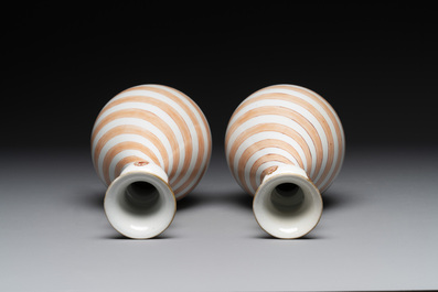 A rare pair of Chinese pear-shaped bottle vases with iron-red swirls, Kangxi