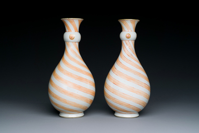 A rare pair of Chinese pear-shaped bottle vases with iron-red swirls, Kangxi