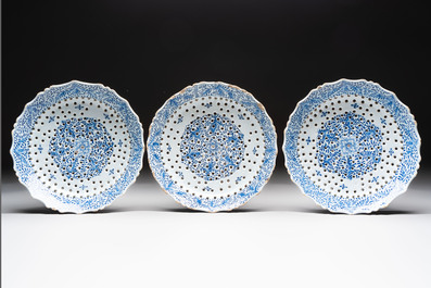 Three blue and white Dutch Delft strawberry strainers on stands, 18th C.
