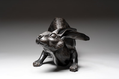 A large Japanese bronze sculpture of a reclining hare, 20th C.