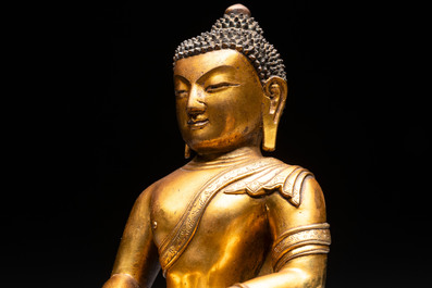 A fine Sino-Tibetan gilt-bronze figure of Buddha Shakyamuni, 17th C.