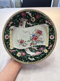 A pair of fine Chinese famille rose black-ground 'scrolls and flowers' plates, Yongzheng/Qianlong