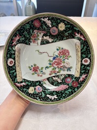 A pair of fine Chinese famille rose black-ground 'scrolls and flowers' plates, Yongzheng/Qianlong