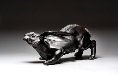 A large Japanese bronze sculpture of a reclining hare, 20th C.