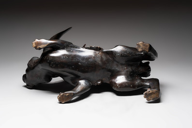 A large Japanese bronze sculpture of a reclining hare, 20th C.