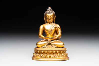 A fine Sino-Tibetan gilt-bronze figure of Buddha Shakyamuni, 17th C.