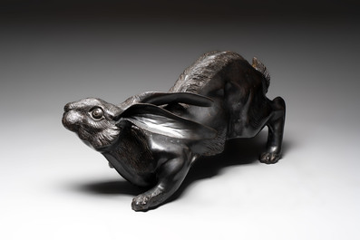A large Japanese bronze sculpture of a reclining hare, 20th C.