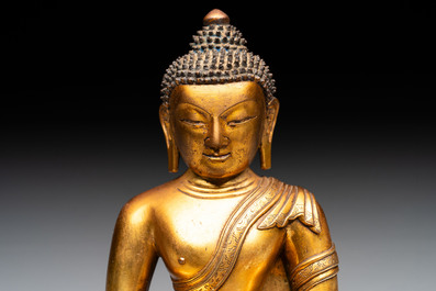 A fine Sino-Tibetan gilt-bronze figure of Buddha Shakyamuni, 17th C.