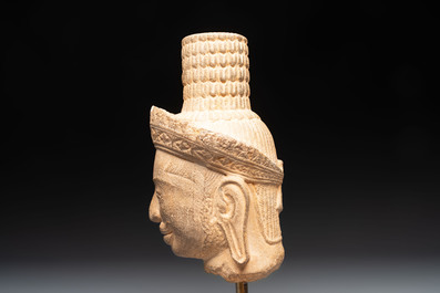A Khmer Angkor Wat-style sandstone head of Shiva, probably 12th C.