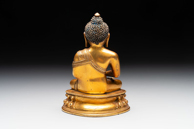 A fine Sino-Tibetan gilt-bronze figure of Buddha Shakyamuni, 17th C.