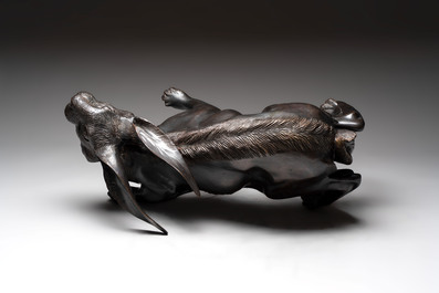 A large Japanese bronze sculpture of a reclining hare, 20th C.