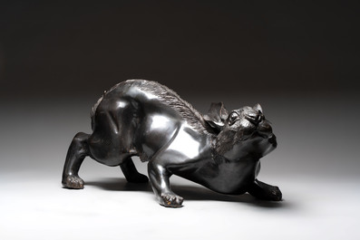 A large Japanese bronze sculpture of a reclining hare, 20th C.