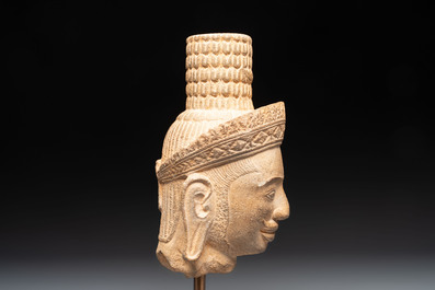 A Khmer Angkor Wat-style sandstone head of Shiva, probably 12th C.