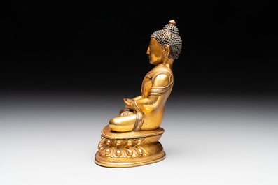 A fine Sino-Tibetan gilt-bronze figure of Buddha Shakyamuni, 17th C.