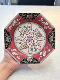A pair of Chinese famille rose ruby-ground octagonal plates with floral design, Yongzheng