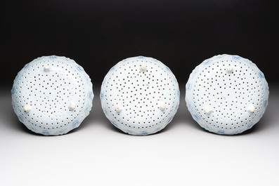 Three blue and white Dutch Delft strawberry strainers on stands, 18th C.