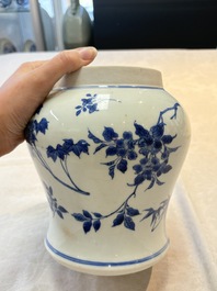 A Chinese blue and white vase with floral design, Transitional period