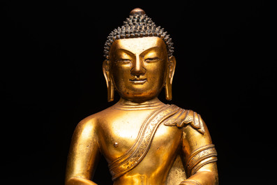 A fine Sino-Tibetan gilt-bronze figure of Buddha Shakyamuni, 17th C.