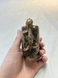 A Chinese gilt-decorated brown-glazed libation cup with a chilong-form handle, Qianlong mark and of the period