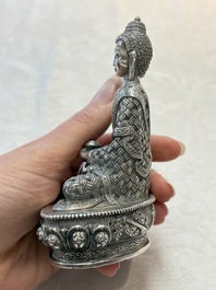 A fine Nepalese silver Buddha, 20th C.